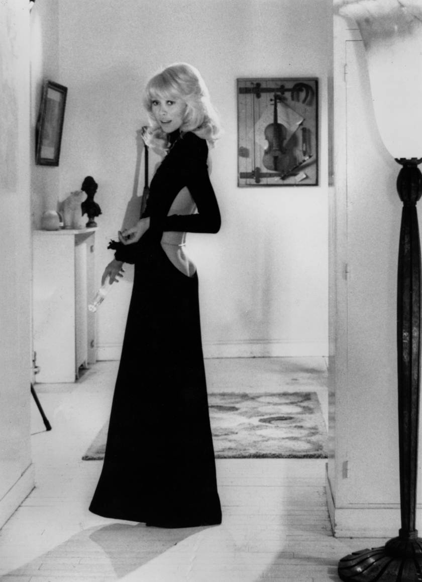 Tall Blond Man with One Black Shoe by YvesRobert with Mireille Darc here wearing a dress by Guy Laroche, 1973